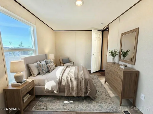 a bedroom with a bed and a mirror