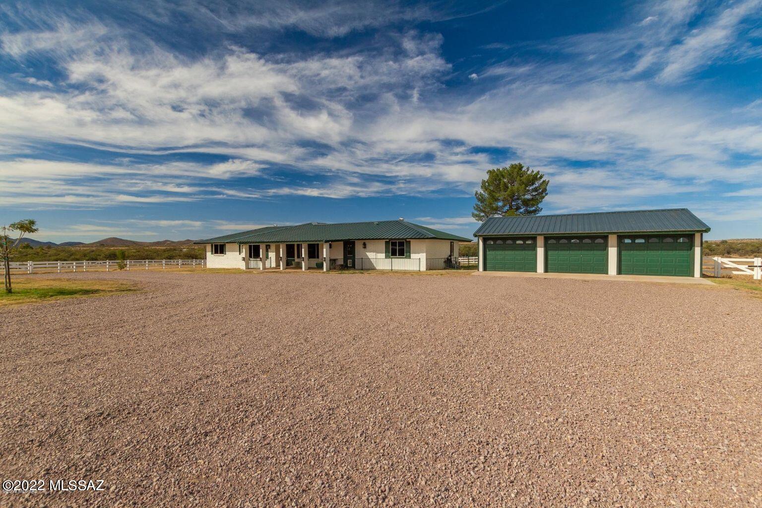 36645 South Arivaca Ranch Road Arivaca, AZ 85601 - Photo 3 of 49 a front view of a house with a yard