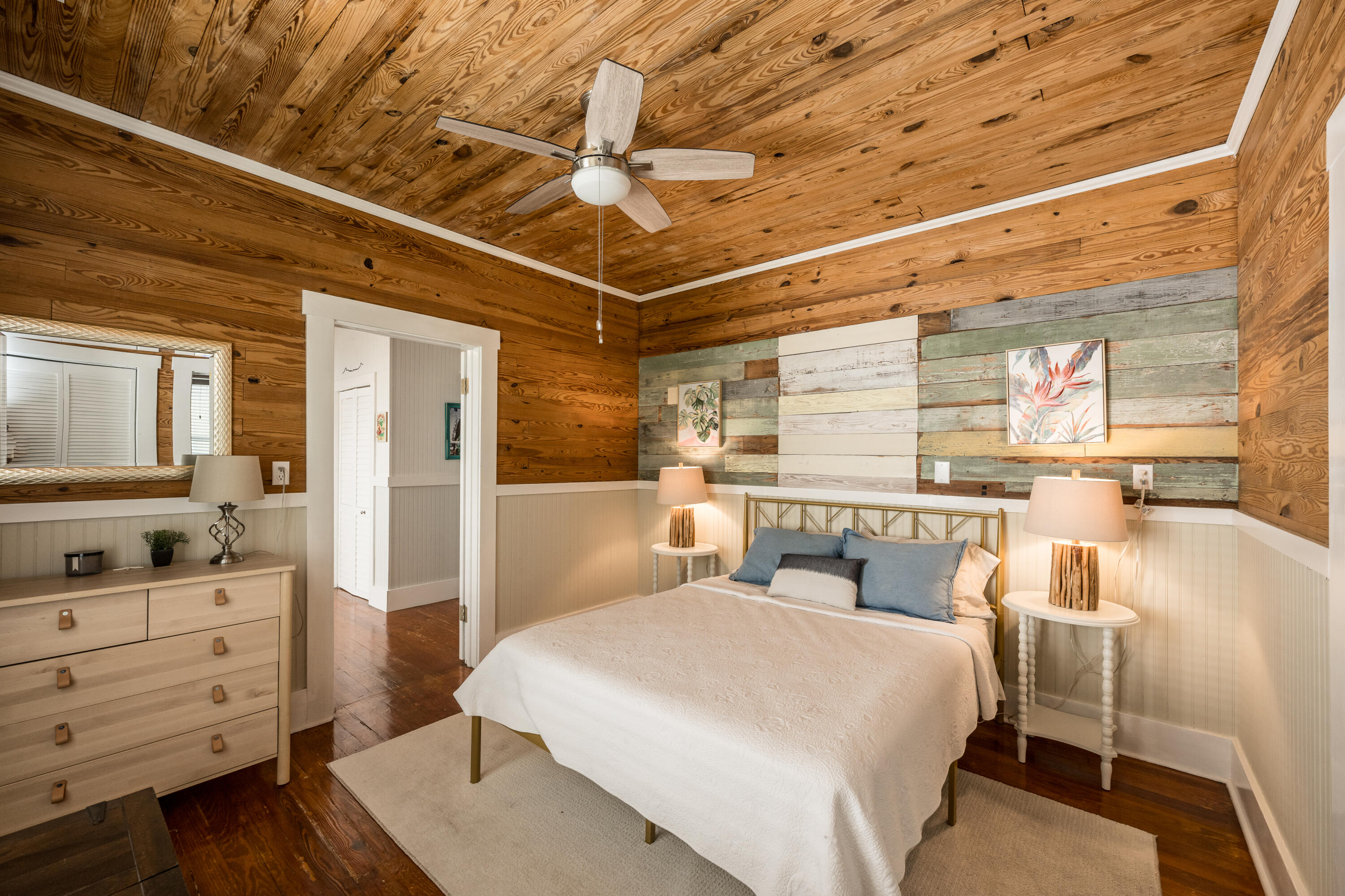 1416 Catherine Street Key West, FL 33040 - Photo 12 of 53 a bedroom with a bed a dresser and flat screen tv