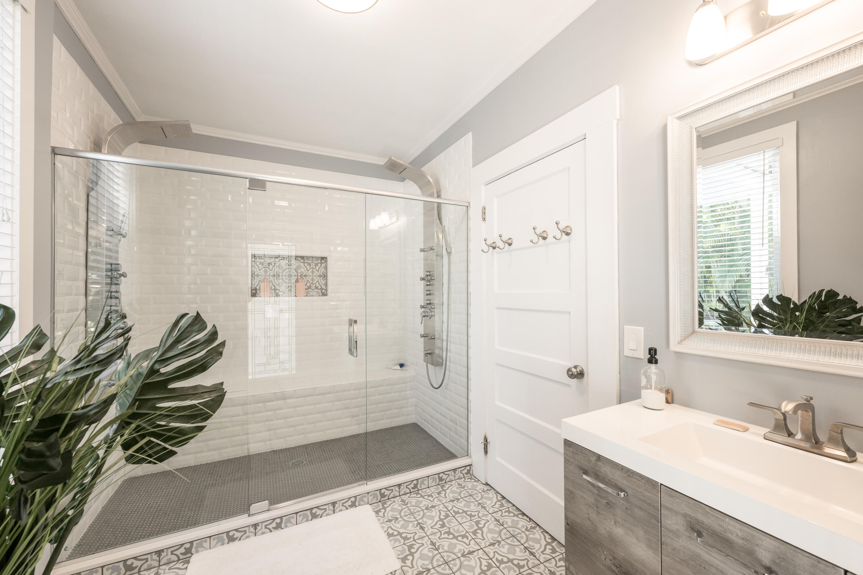 1416 Catherine Street Key West, FL 33040 - Photo 15 of 53 a bathroom with a granite countertop sink a mirror a bathtub and shower