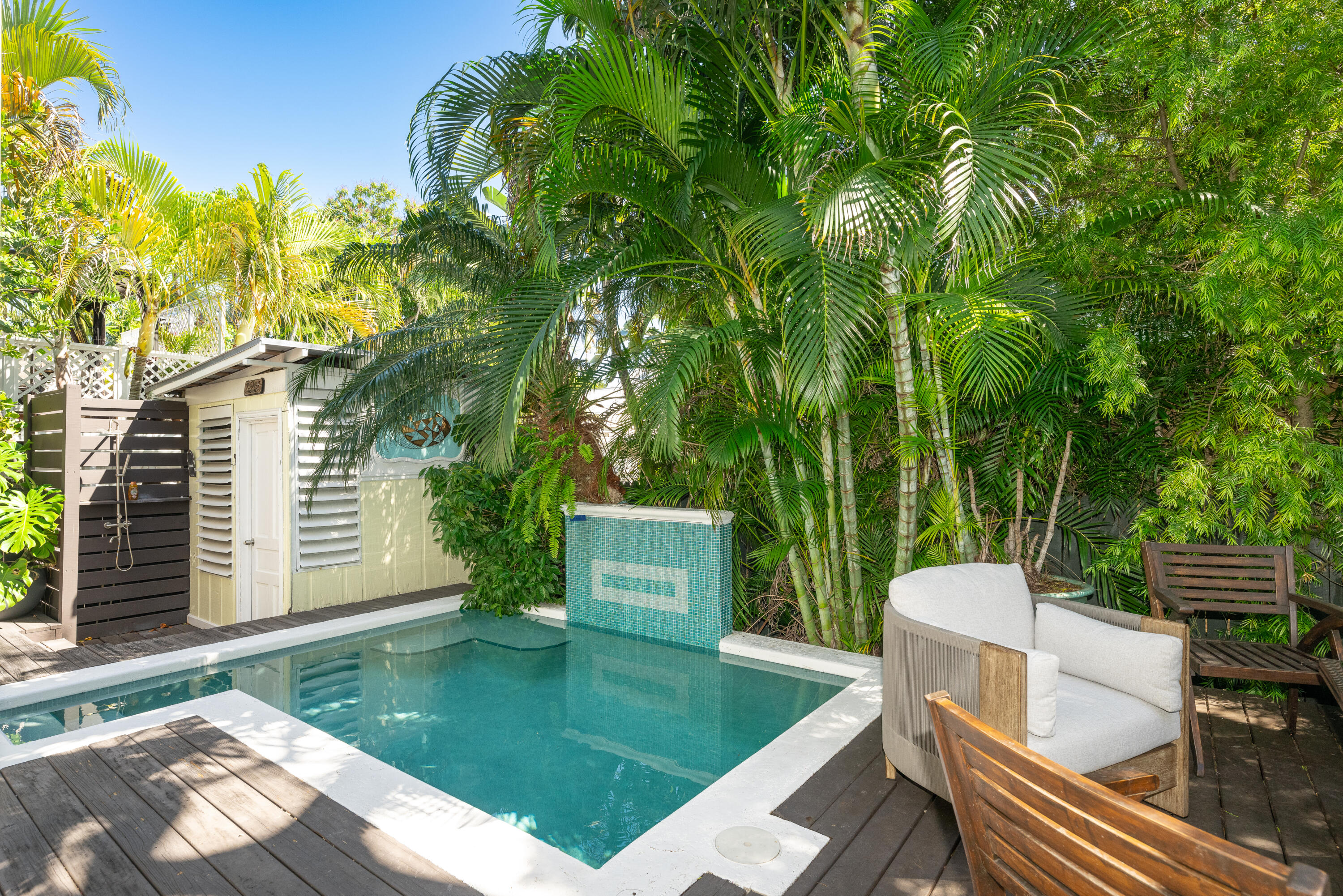 1416 Catherine Street Key West, FL 33040 - Photo 19 of 53 a view of a patio with couches table and chairs and potted plants