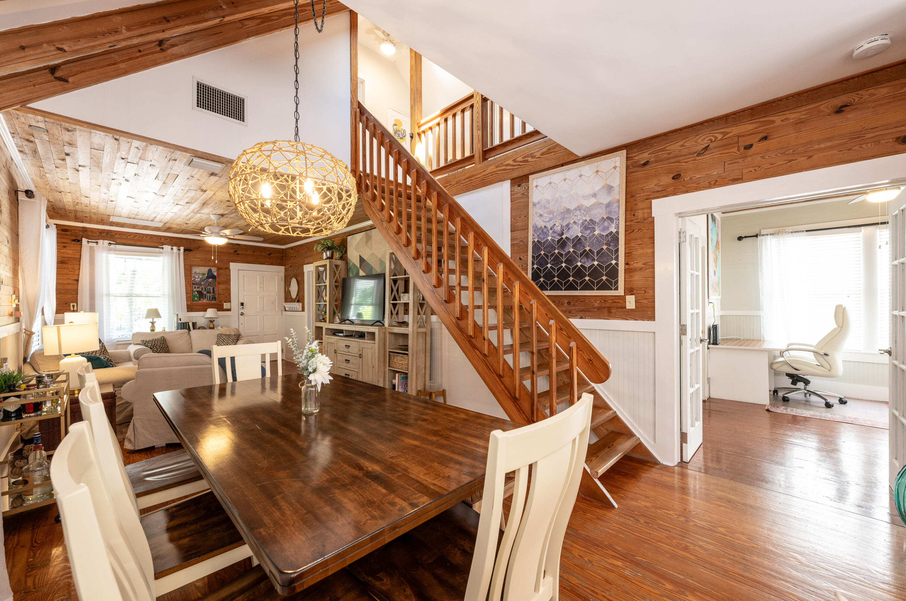 1416 Catherine Street Key West, FL 33040 - Photo 2 of 53 a view of dining room and livingroom with furniture wooden floor a rug and a chandelier