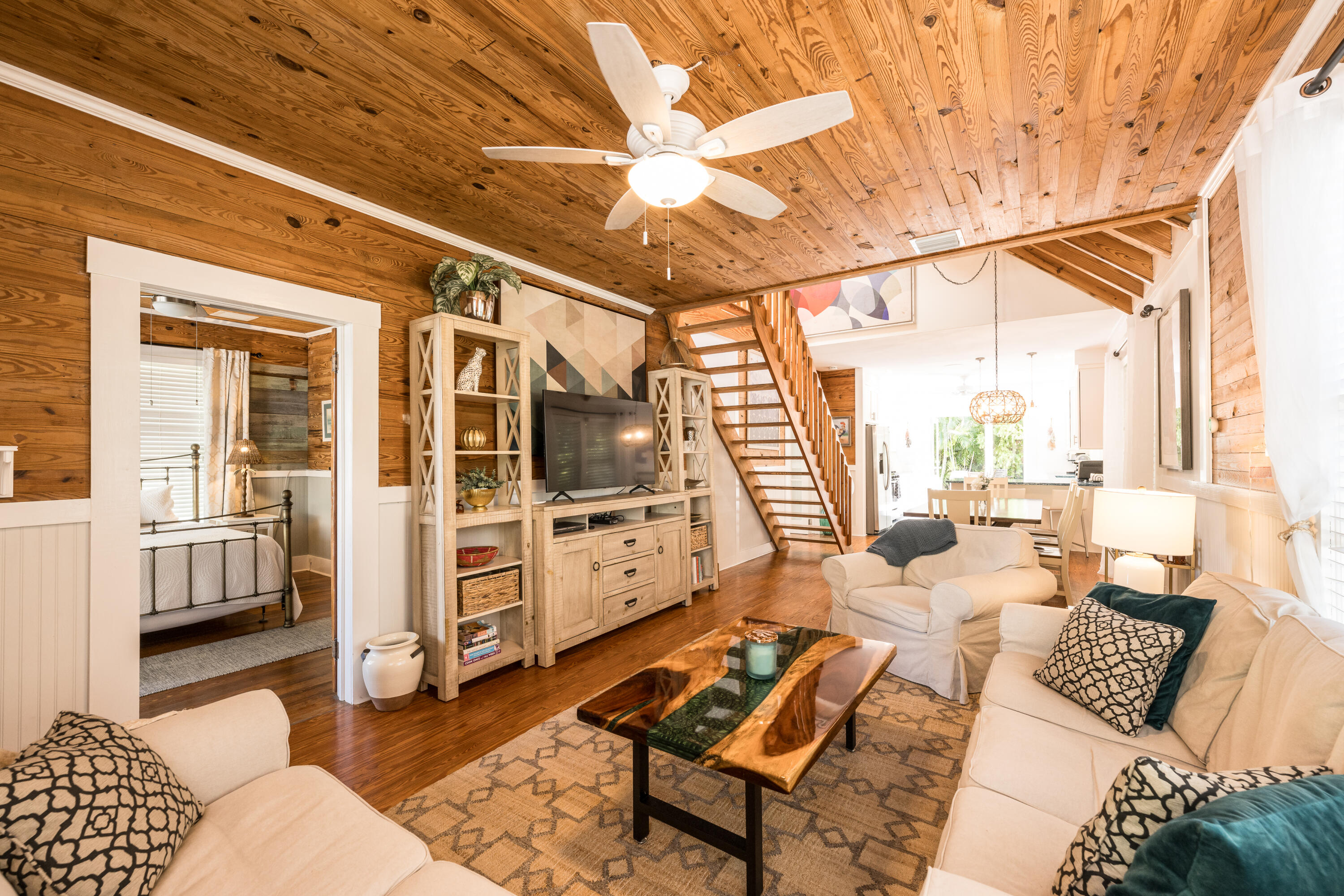 1416 Catherine Street Key West, FL 33040 - Photo 33 of 53 a living room with furniture a flat screen tv and a floor to ceiling window