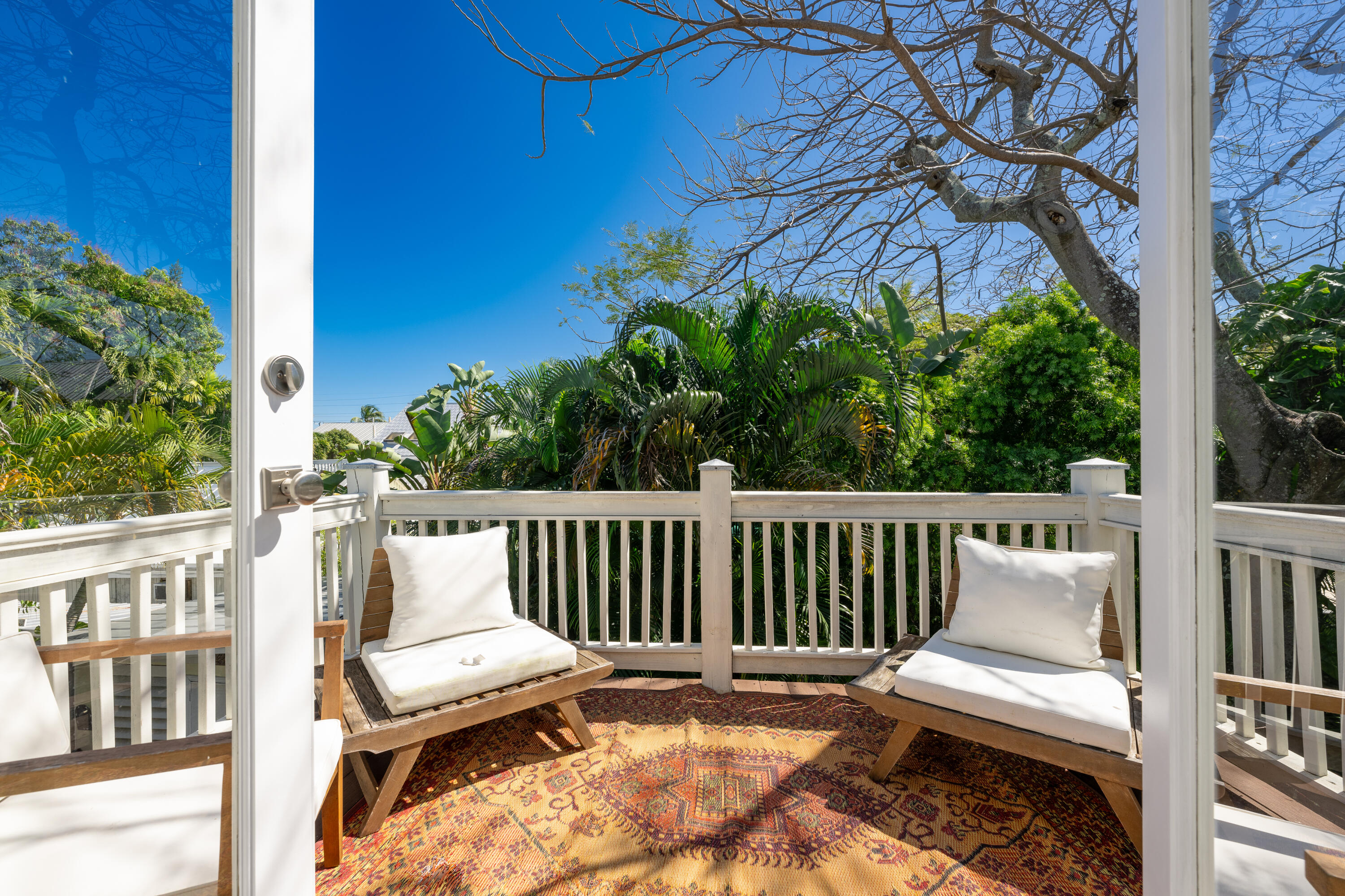 1416 Catherine Street Key West, FL 33040 - Photo 46 of 53 a view of a chair in wooden deck