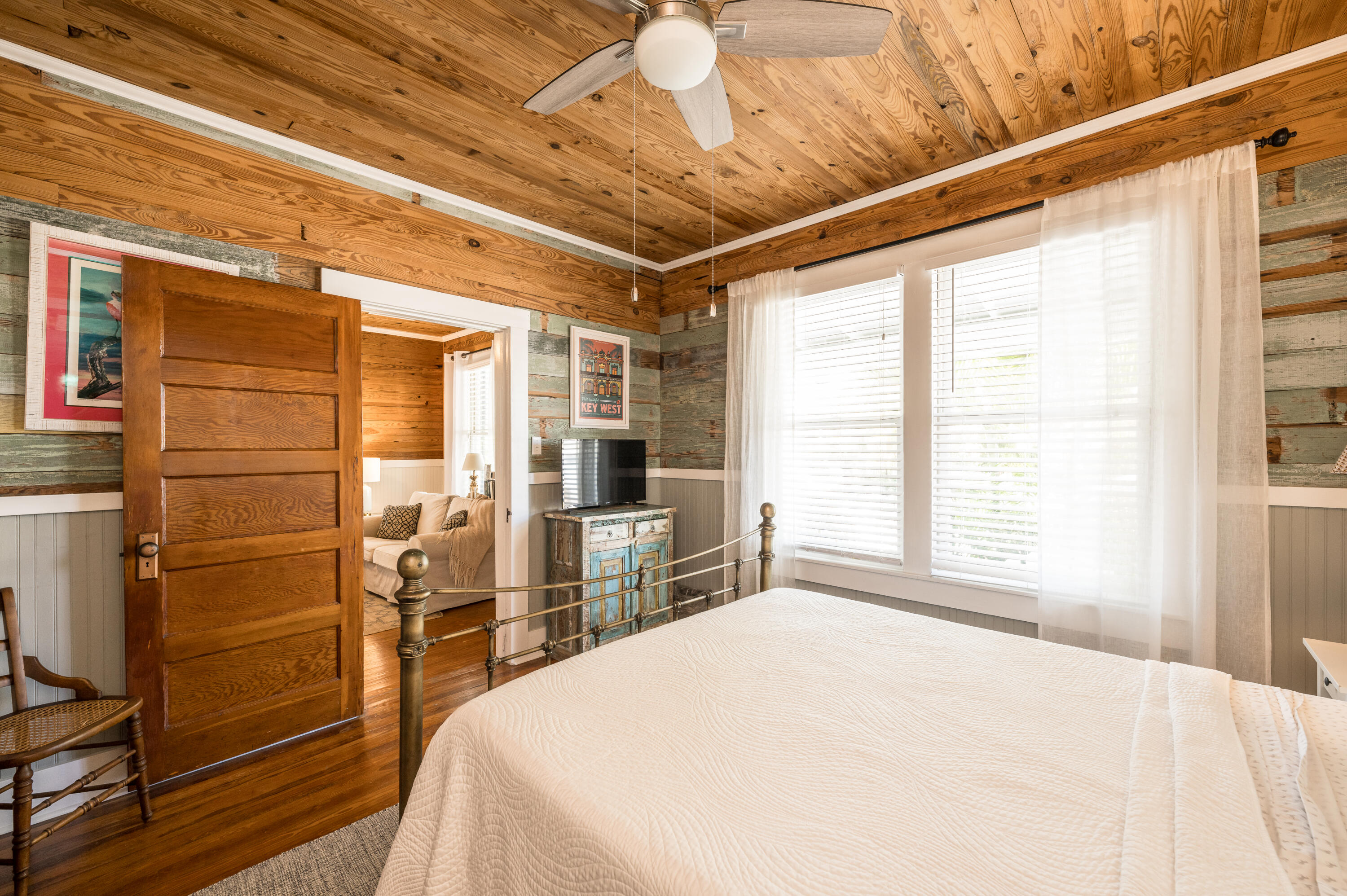 1416 Catherine Street Key West, FL 33040 - Photo 8 of 53 a spacious bedroom with a large bed and a chandelier