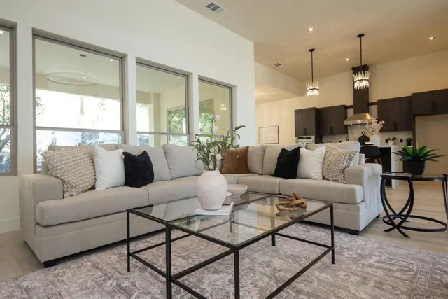 a living room with furniture and a fireplace