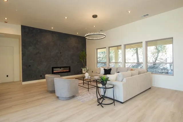 a view of a dining room with furniture wooden floor and chandelier