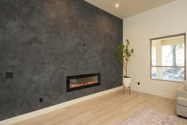 a kitchen with a sink a stove and chairs