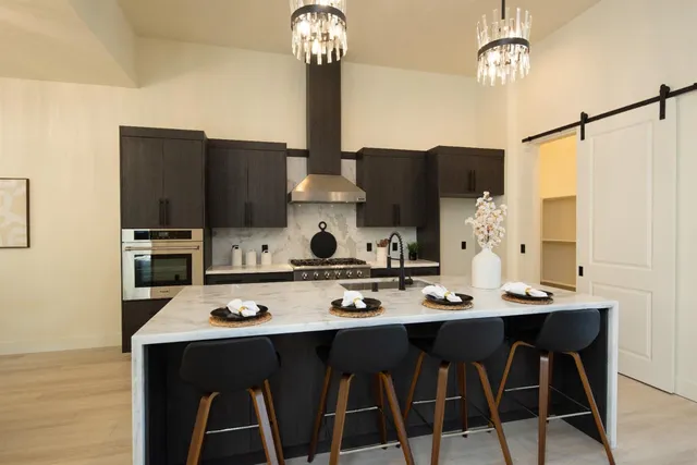 a kitchen with a stove and a refrigerator