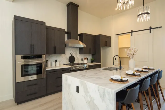 a kitchen with a stove and a refrigerator
