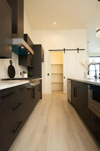 a view of a a dining room with furniture window and wooden floor
