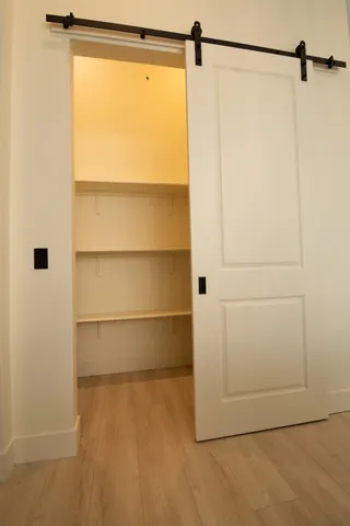 a dining room with furniture a chandelier and window