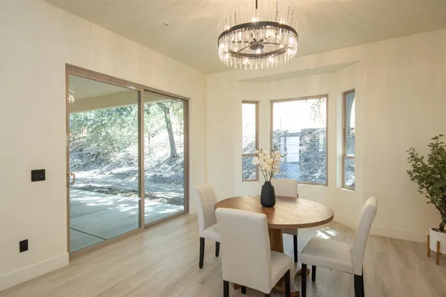 a spacious bathroom with a granite countertop sink and a mirror