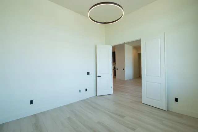 a bathroom with a double vanity sink a mirror and a bathtub