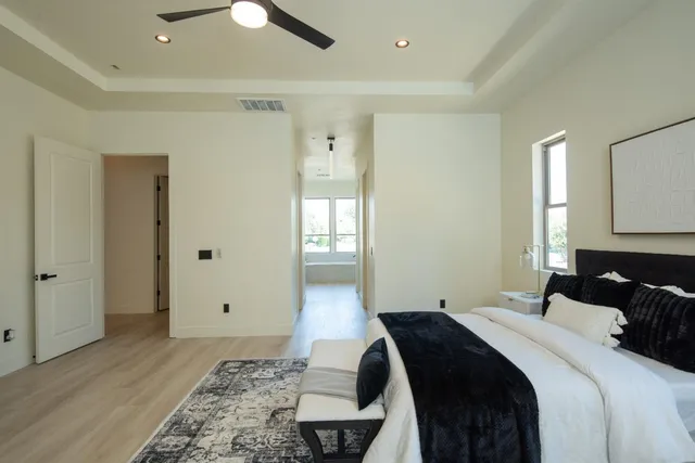 a bathroom with a toilet a sink a mirror and bathtub