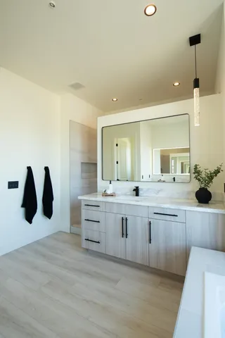 a view of a white wall with cabinets