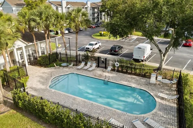 an aerial view of a house with a swimming pool