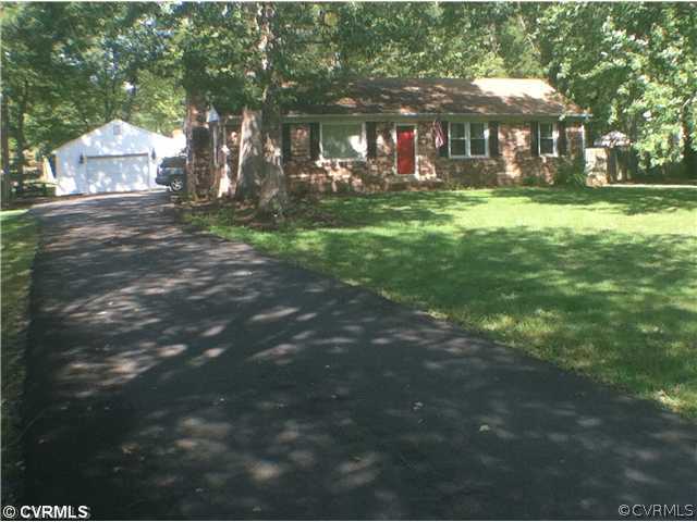 a view of a big yard in front of the house