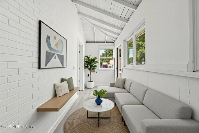a living room with furniture and window