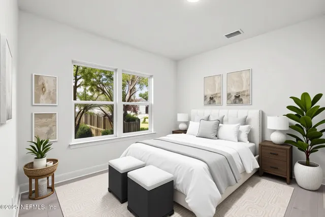 a bedroom with a bed and a chair