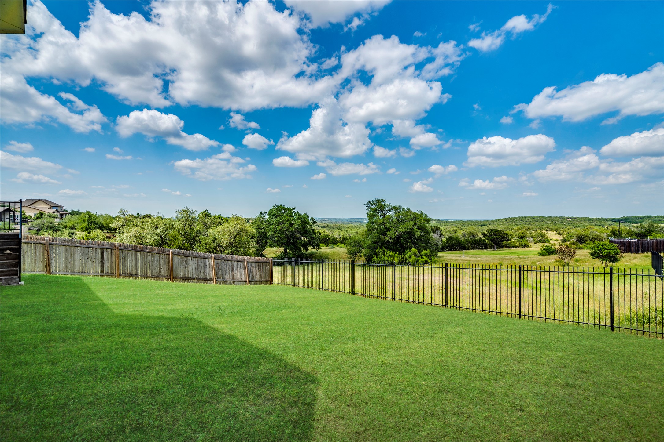 130 Sierra Blanca Road Dripping Springs, TX 78620 - Photo 5 of 24 a view of a golf course with a lake