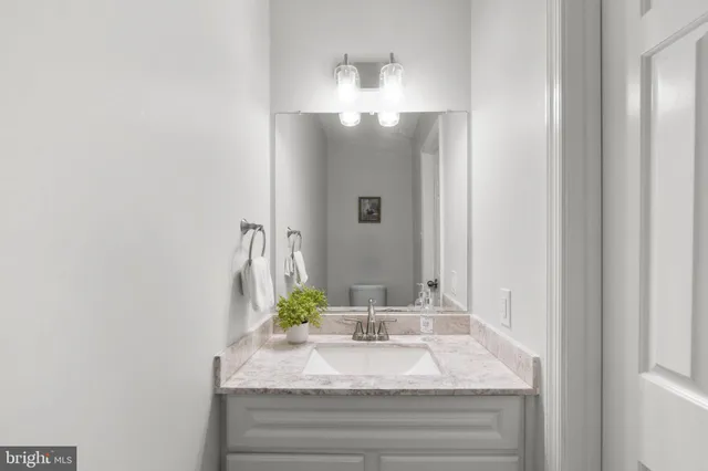 a view of a room with a wooden floor and a window