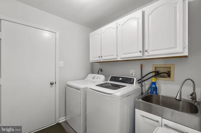 a bathroom with a granite countertop sink mirror and vanity