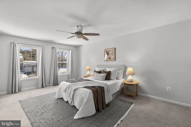 a bathroom with a granite countertop sink a mirror and vanity