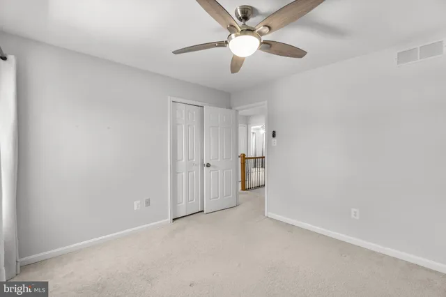 a view of a room with gym equipment and a large window