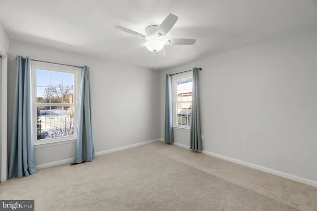 a view of a workspace with furniture and wooden floor