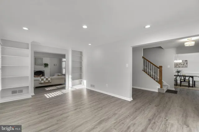a view of an empty room and wooden floor