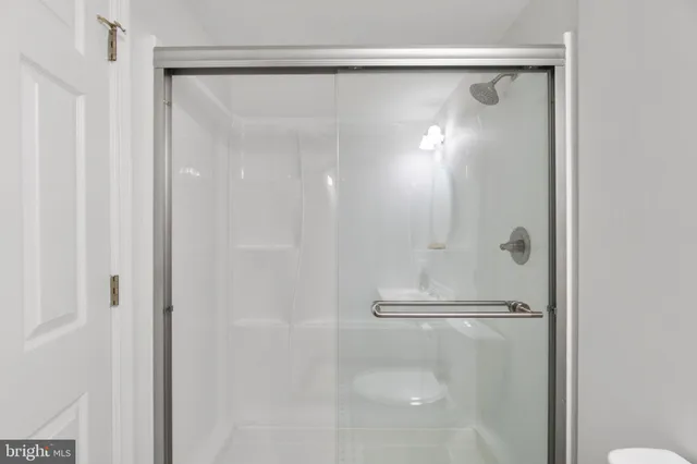 a picture of a bathroom with a shower