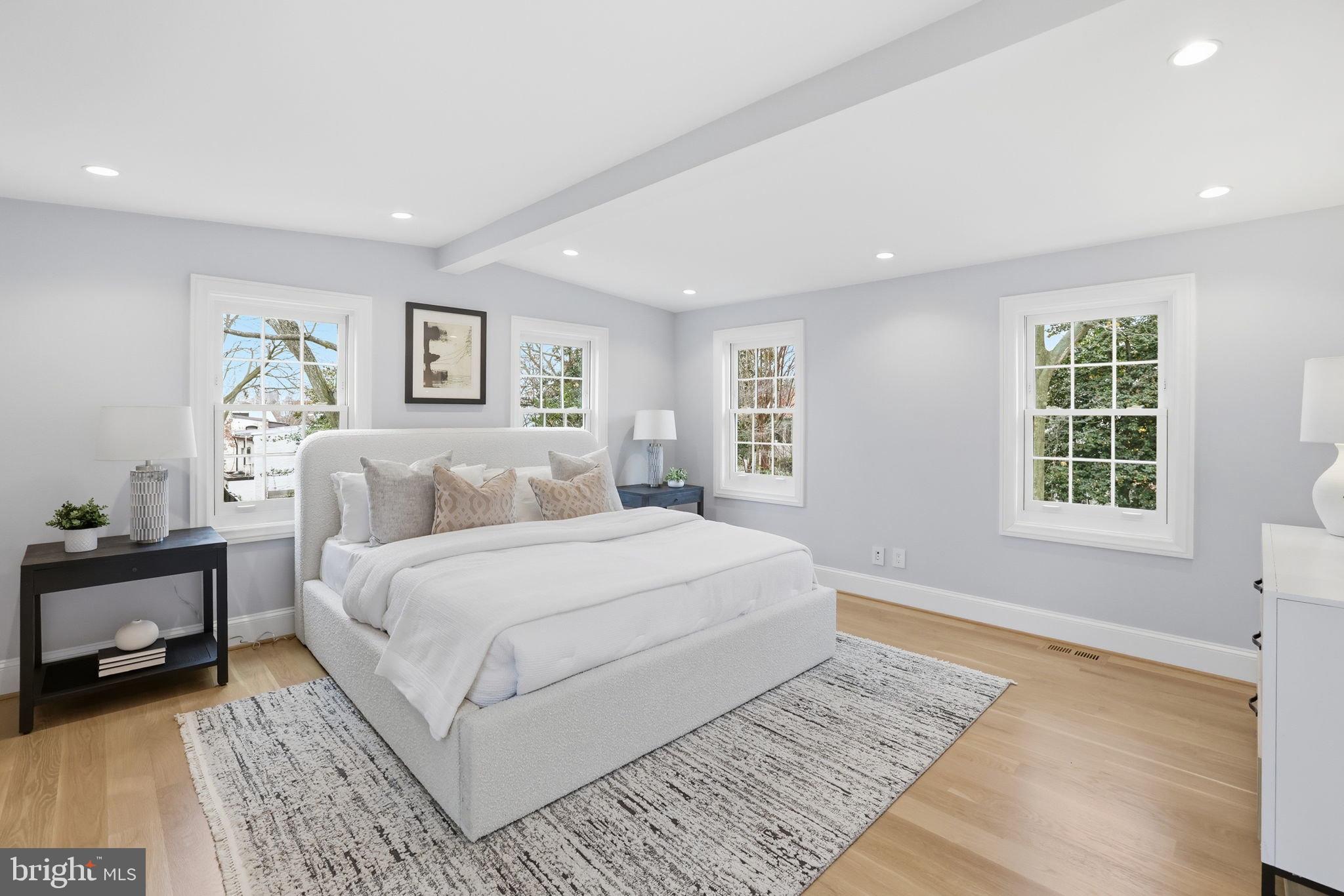 3418 Reservoir Road Northwest Washington, DC 20007 - Photo 16 of 33 a spacious bedroom with a large bed and a window