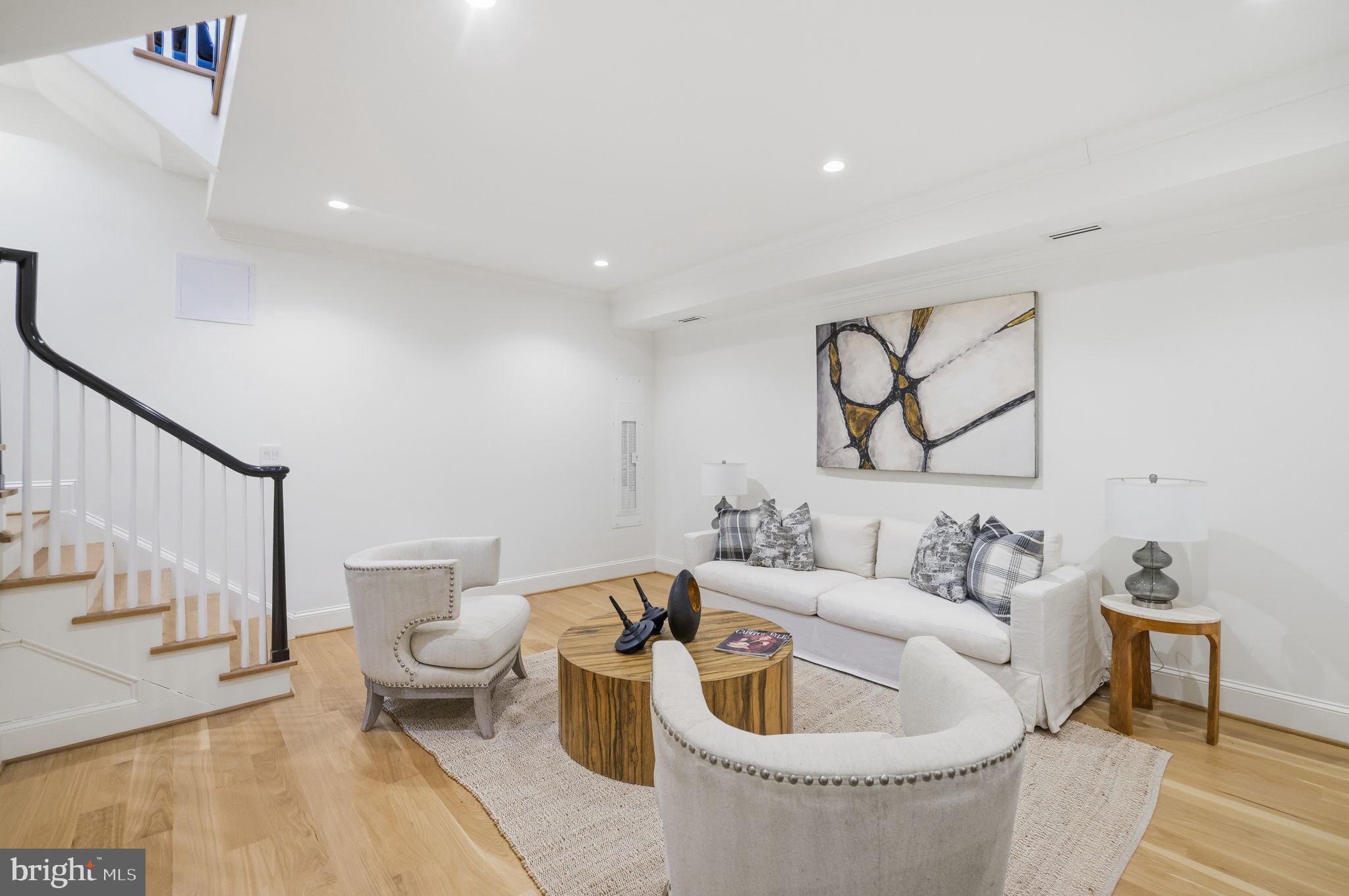 3418 Reservoir Road Northwest Washington, DC 20007 - Photo 26 of 33 a living room with furniture and a painting on the wall