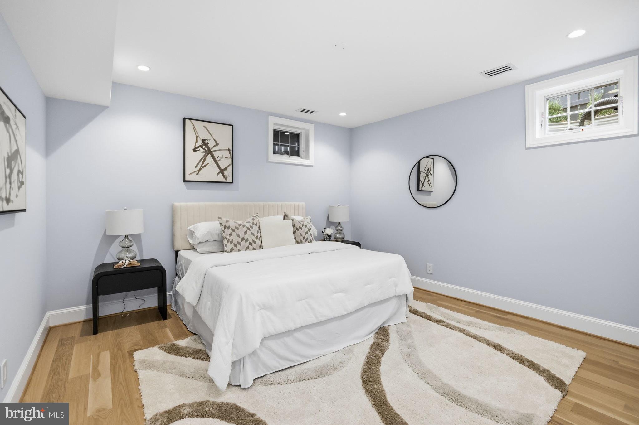 3418 Reservoir Road Northwest Washington, DC 20007 - Photo 27 of 33 a bedroom with a bed and painting on the wall