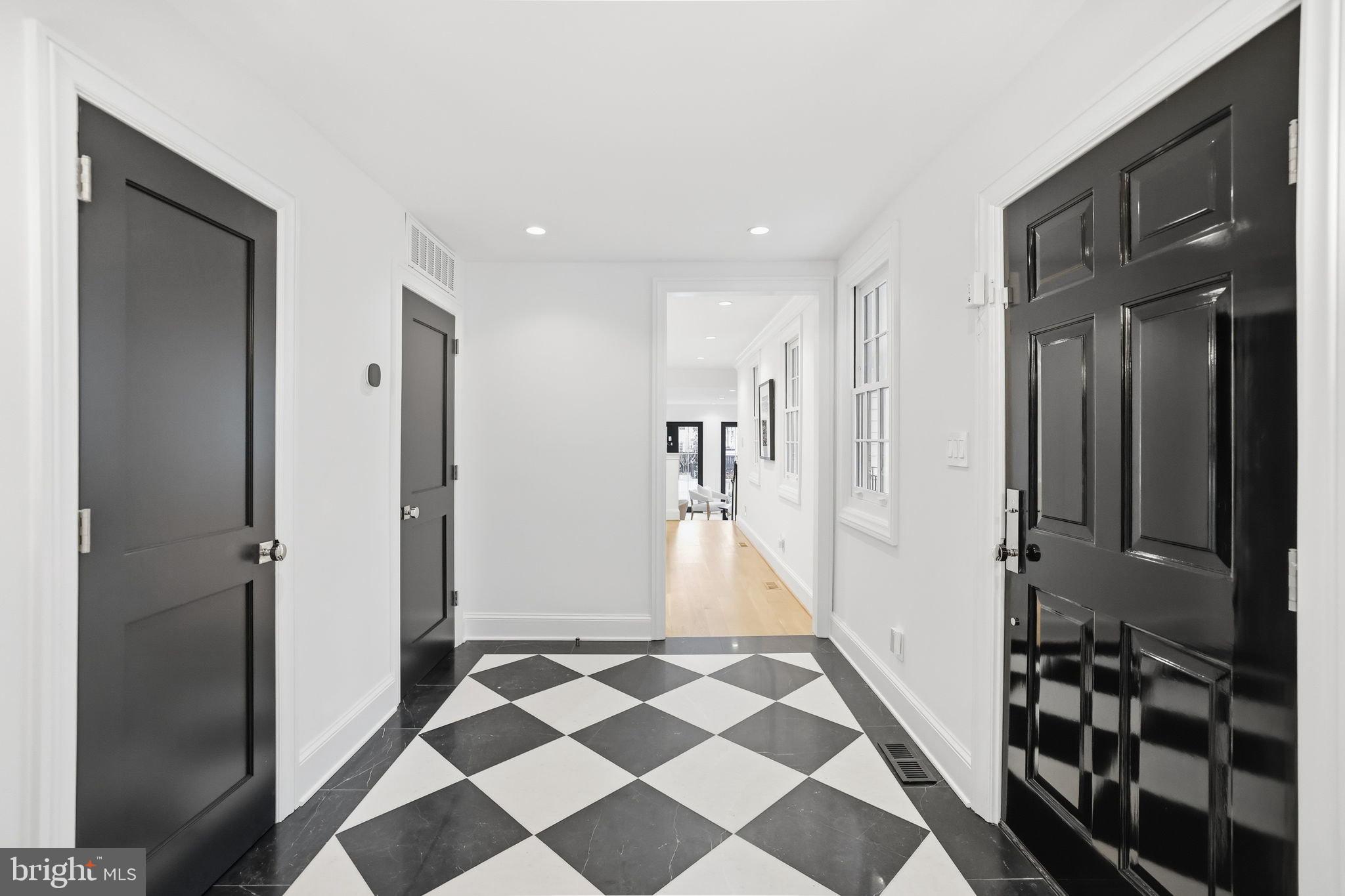 3418 Reservoir Road Northwest Washington, DC 20007 - Photo 4 of 33 a view of a bathroom with a black and white checkered floor