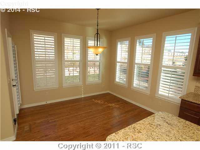 2328 Rusty Ridge Court Colorado Springs, CO 80921 - Photo 5 of 16 Breakfast Nook adjoins Kitchen with door to the Back Patio.