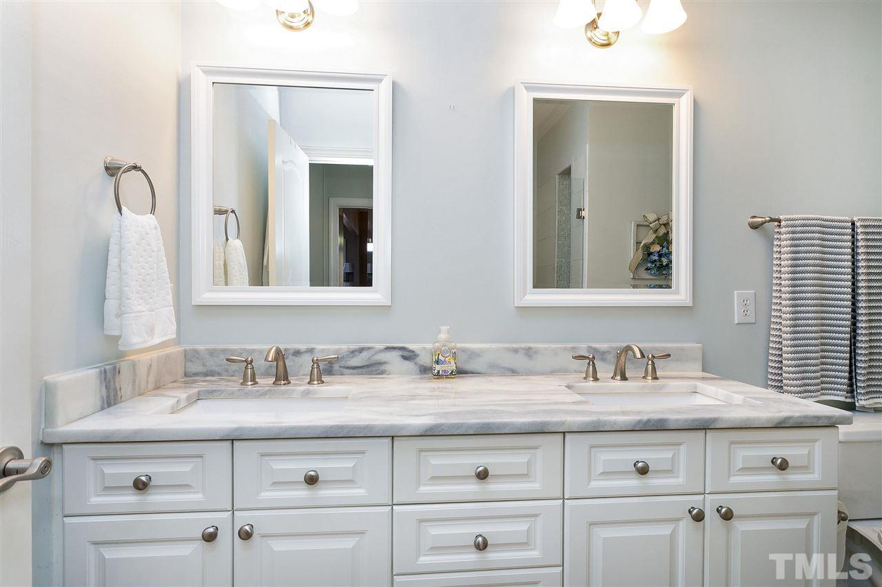 8216 Lloyd Allyns Way Raleigh, NC 27615 - Photo 12 of 30 Double vanity with grey and white marble top.
