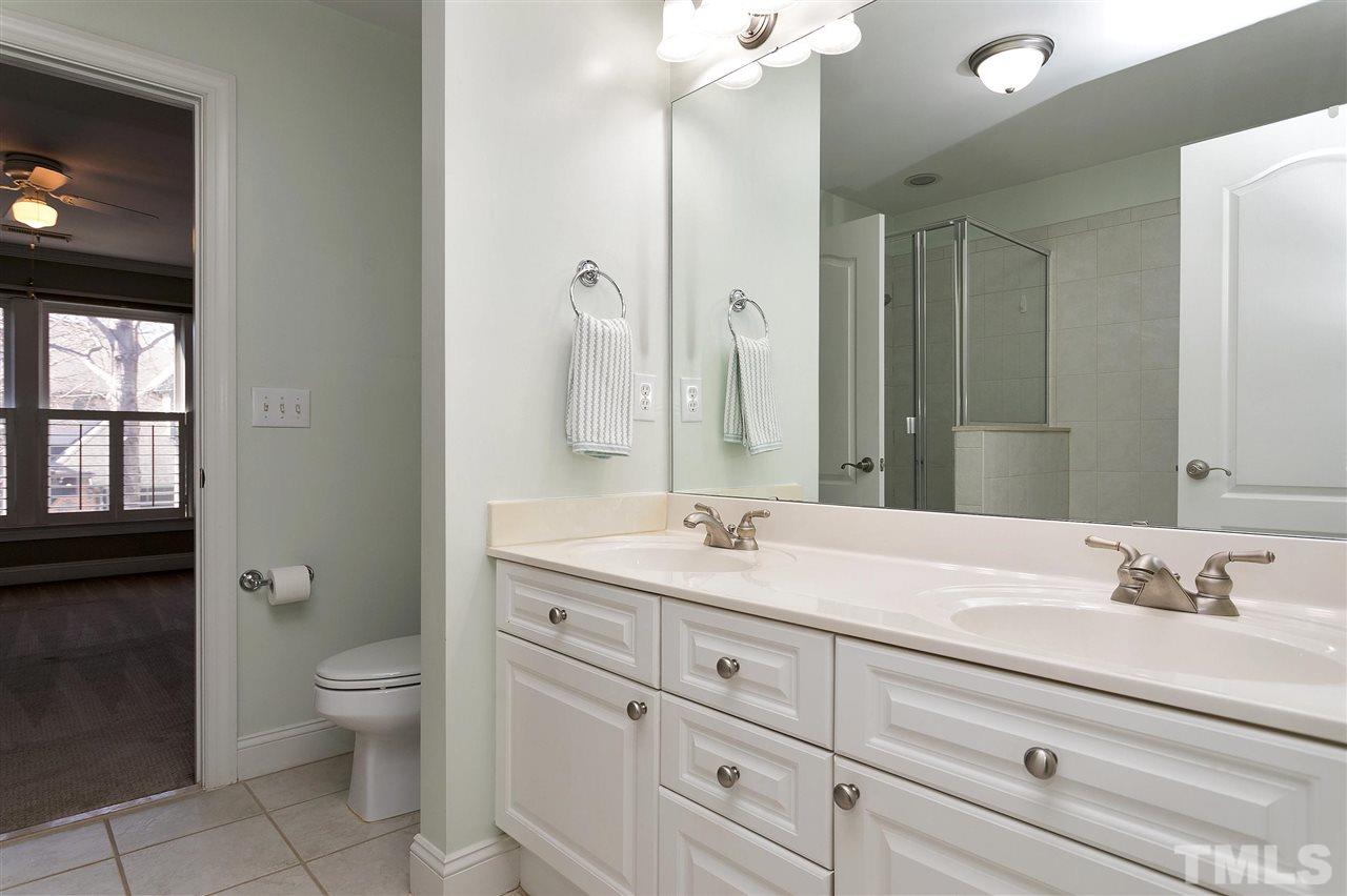 8216 Lloyd Allyns Way Raleigh, NC 27615 - Photo 18 of 30 'Jack & Jill' bath upstairs with double vanity and separate tub and shower.