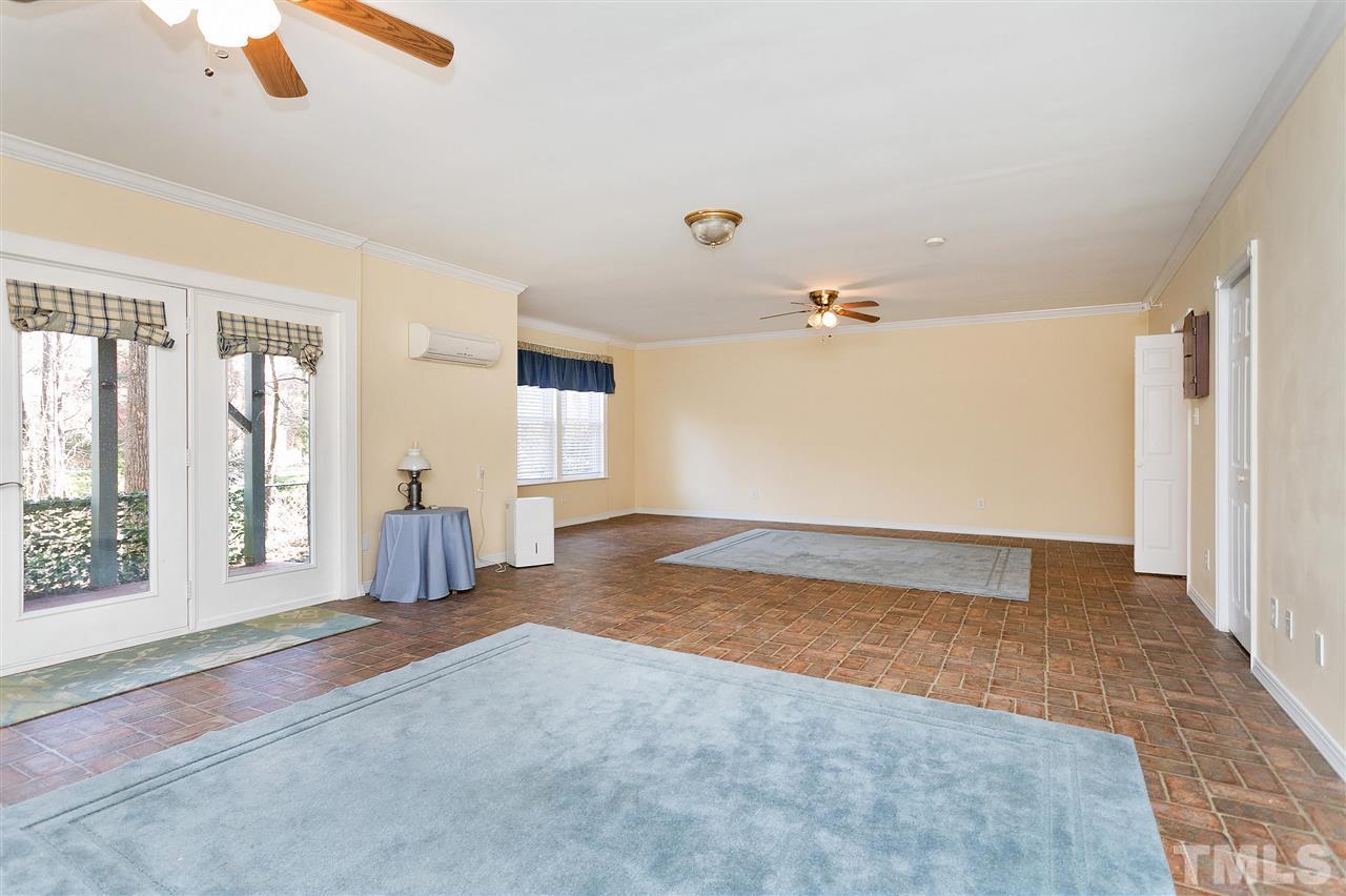 8216 Lloyd Allyns Way Raleigh, NC 27615 - Photo 19 of 30 Full, finished daylight basement with doors to lower level patio is HUGE. Heated and cooled with Mitsubishi split system. With full bath already in place and the option to add wall to create a bedroom, this could be an 'in-law suite.'