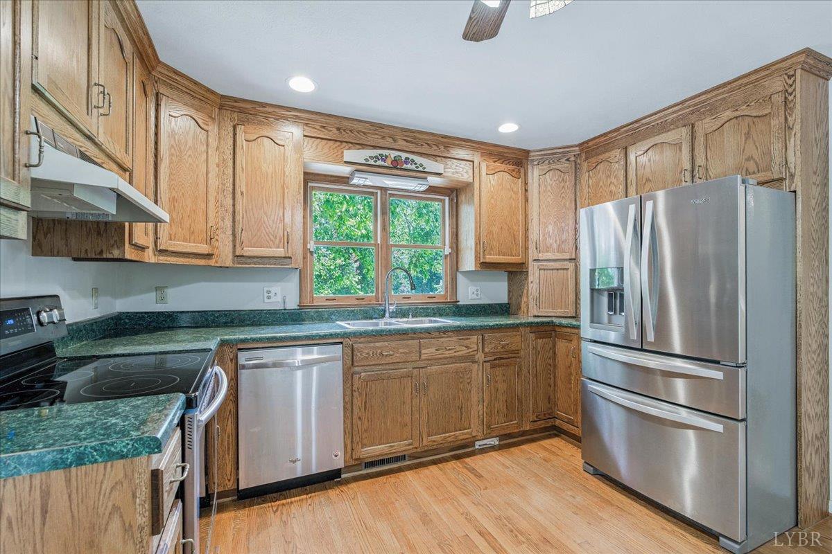530 Patteson School Road Appomattox, VA 24522 - Photo 14 of 45 a kitchen with stainless steel appliances granite countertop a refrigerator and a sink