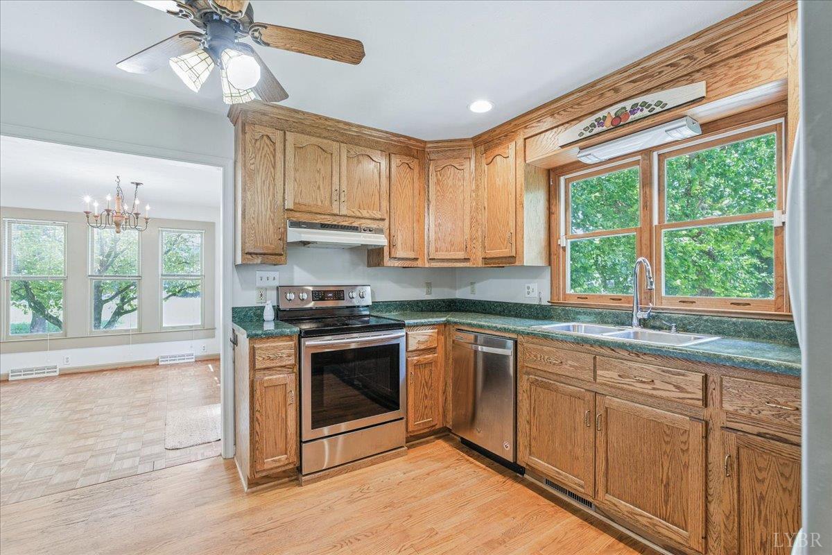 530 Patteson School Road Appomattox, VA 24522 - Photo 15 of 45 a kitchen with a stove a sink and a microwave
