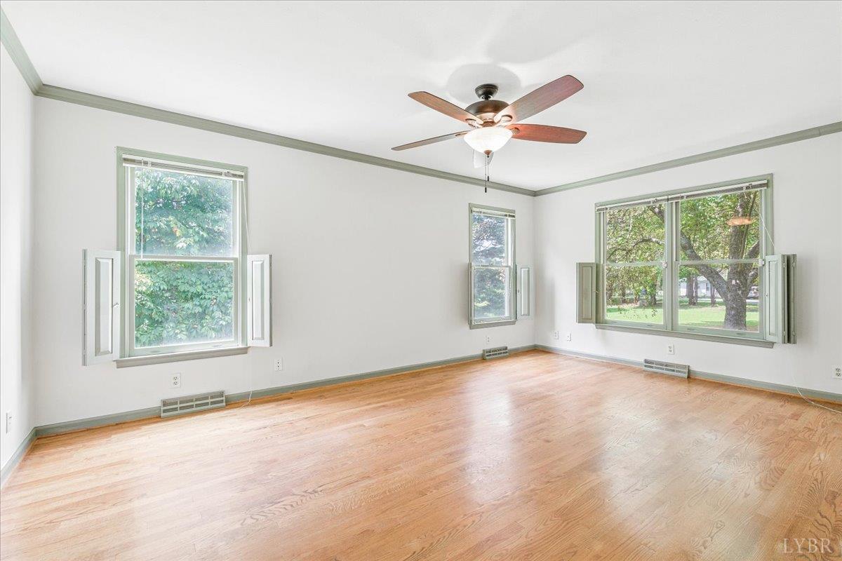 530 Patteson School Road Appomattox, VA 24522 - Photo 18 of 45 an empty room with windows and fan