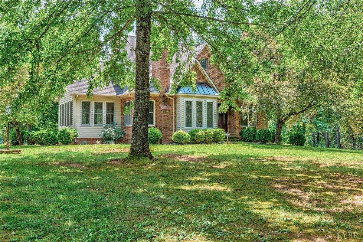 530 Patteson School Road Appomattox, VA 24522 - Photo 2 of 45 a view of a house with a big yard plants and large trees