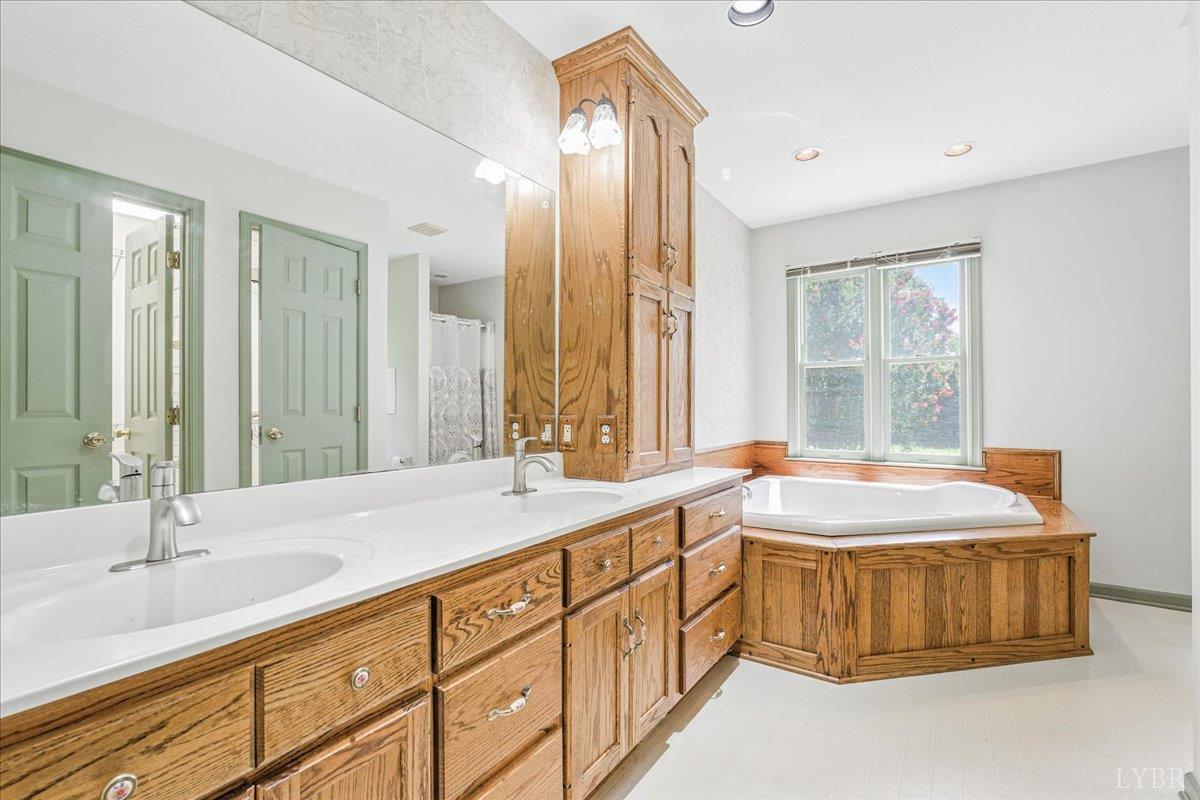 530 Patteson School Road Appomattox, VA 24522 - Photo 21 of 45 a spacious bathroom with a tub sink and mirror