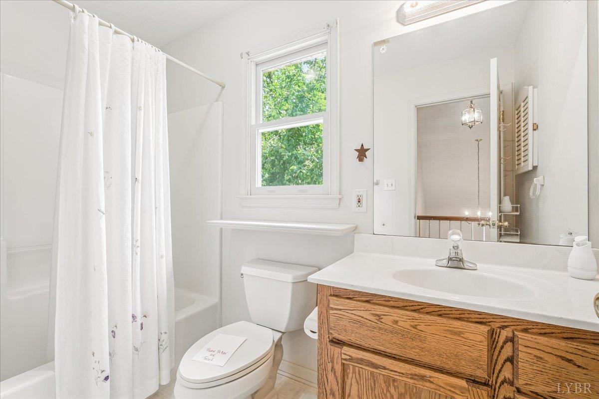 530 Patteson School Road Appomattox, VA 24522 - Photo 27 of 45 a bathroom with a sink a toilet and a window