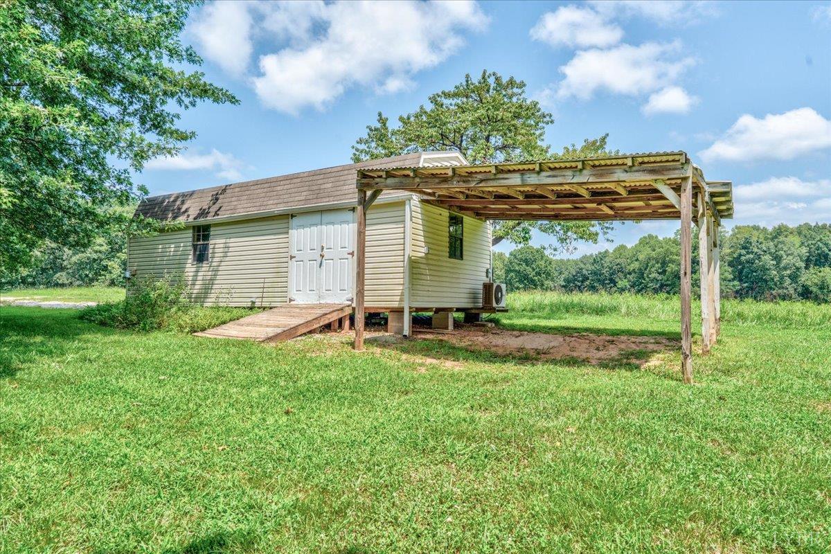 530 Patteson School Road Appomattox, VA 24522 - Photo 38 of 45 a view of a house with backyard and a garden