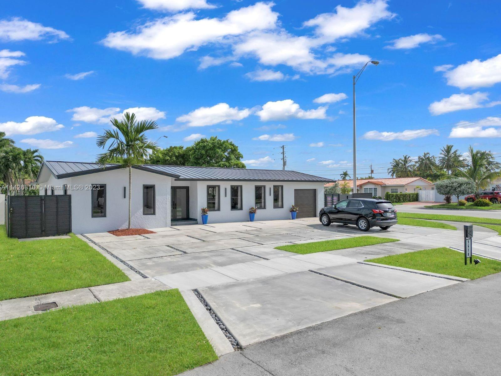 9670 Southwest 17th Street Miami, FL 33165 - Photo 1 of 17 a view of a house with a yard