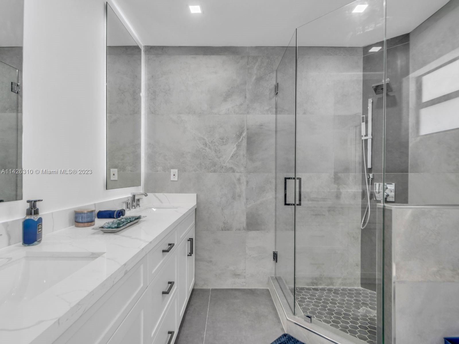 9670 Southwest 17th Street Miami, FL 33165 - Photo 11 of 17 a bathroom with a shower sink and toilet