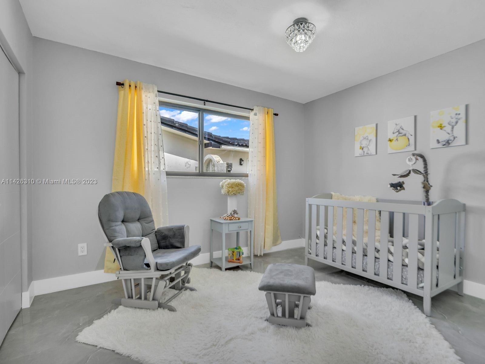 9670 Southwest 17th Street Miami, FL 33165 - Photo 14 of 17 a bedroom with furniture and a window